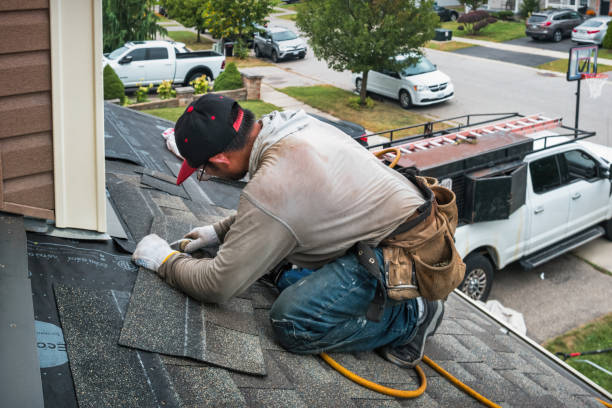 Professional Roofing technician working in Dorena, OR